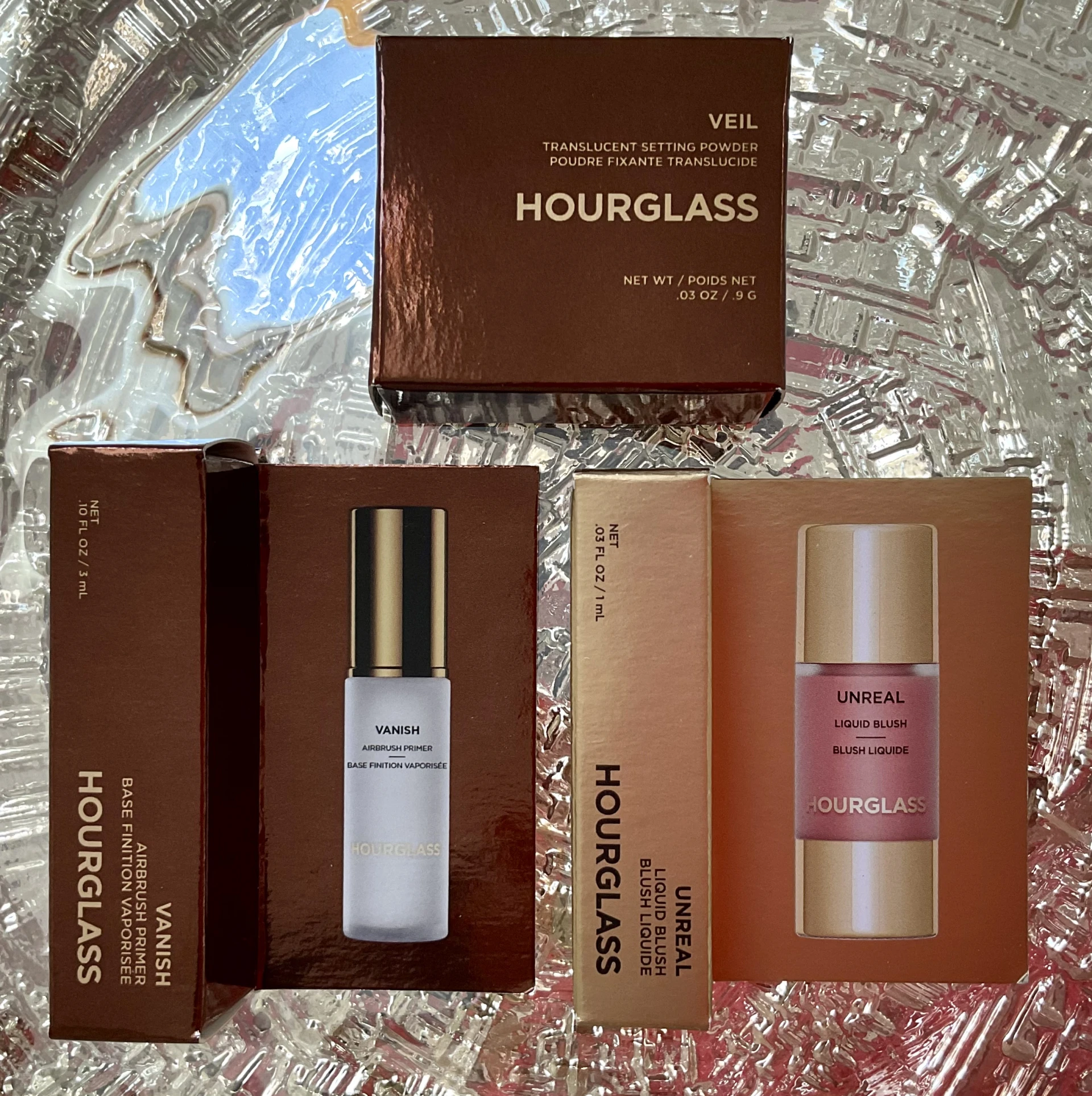 Hourglass Veil™ Translucent Setting Powder, Vanish Airbrush Primer, Unreal Liquid Blush